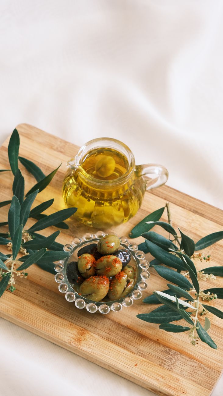 Culinary table with olive oils and regional herbs